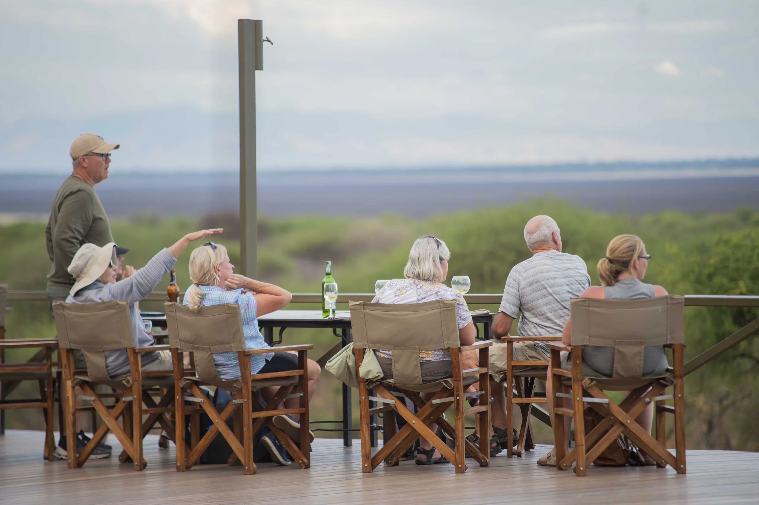 Senior safari guests relaxing on a lodge veranda in Tanzania