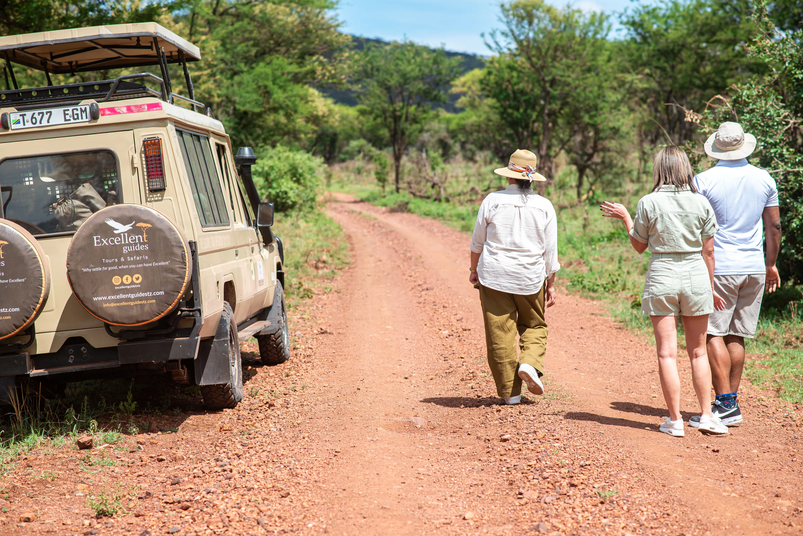 A private safari guest walking beside a guide in Tanzania