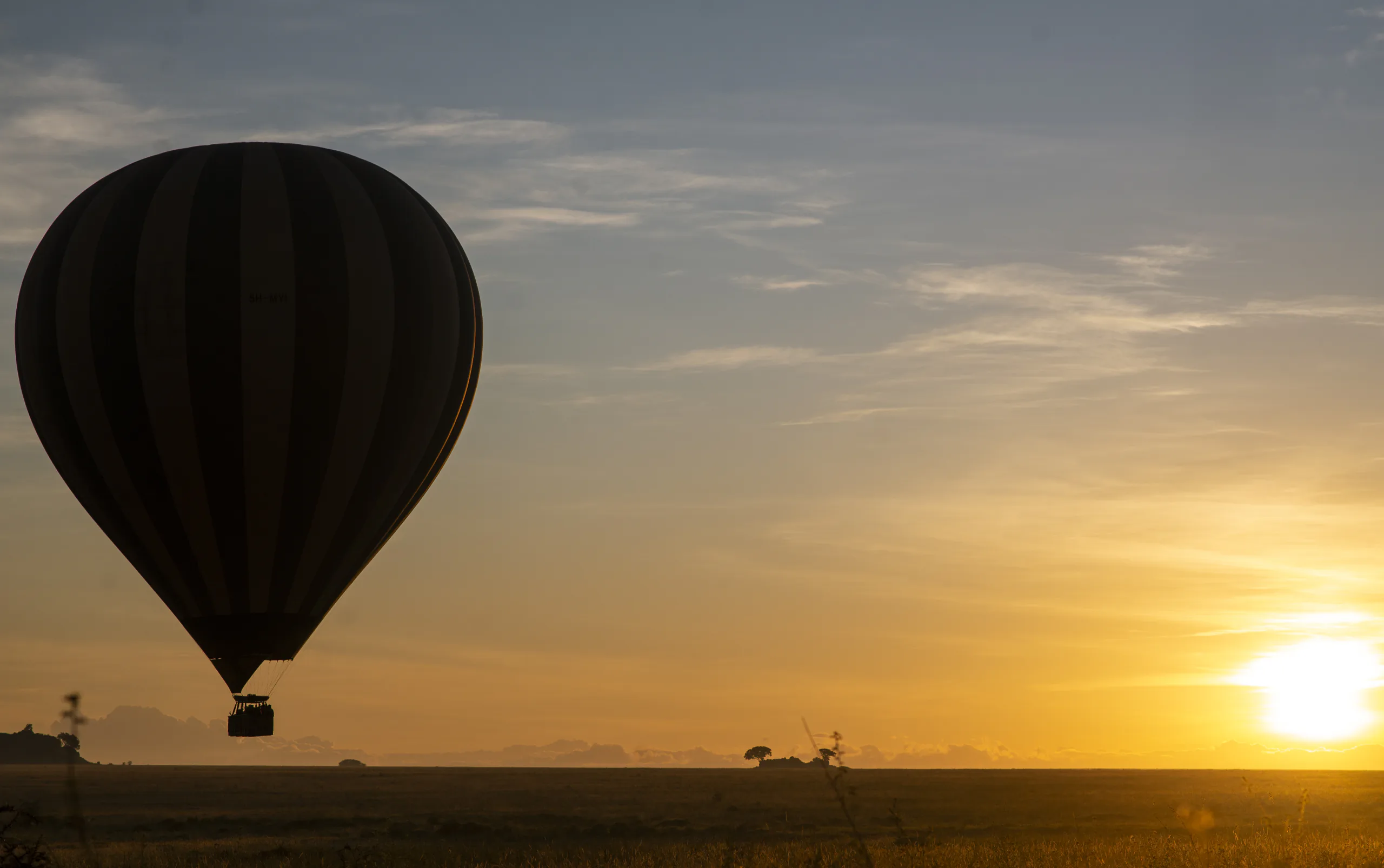 A traveller taking in Tanzania's open wilderness